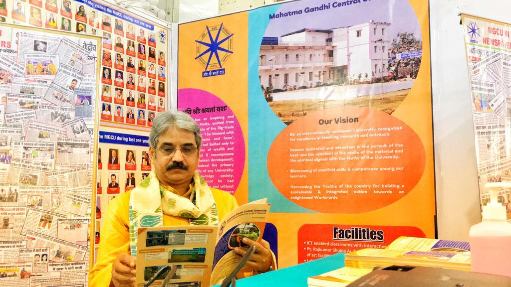 Sarthak EduVision Bhopal: Mahatma Gandhi Central University Vice Chancellor Prof Sanjeev Sharma reading university booklet